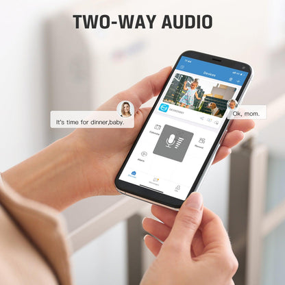 Hands holding a smartphone displaying the Xega camera app with live feed and two-way audio conversation bubbles.
